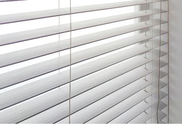 Faux wood blinds installed on a West Hollywood home window