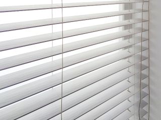 Faux wood blinds installed on a West Hollywood home window